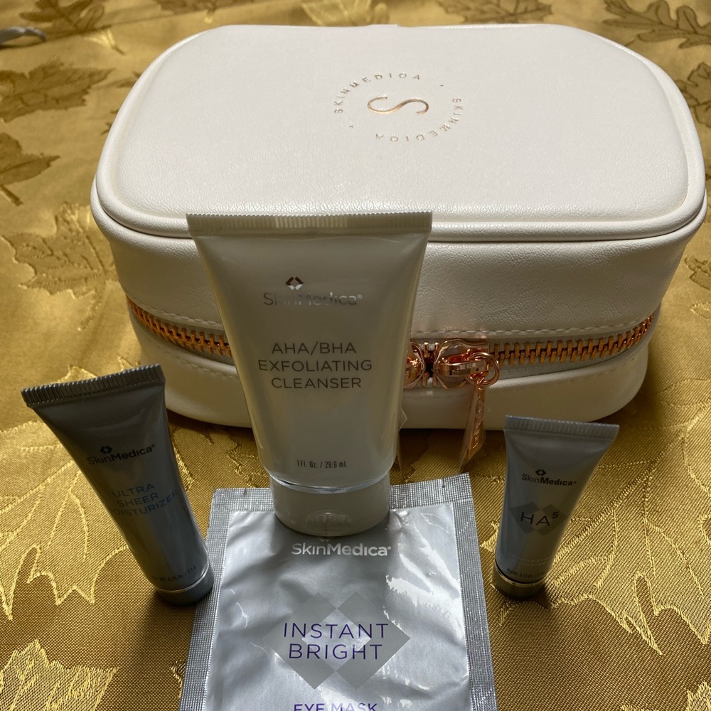 SkinMedica white faux leather gift case with travel sized items.